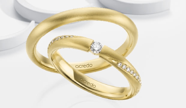 Elegante forlovelsesringe med spændfatning | acredo